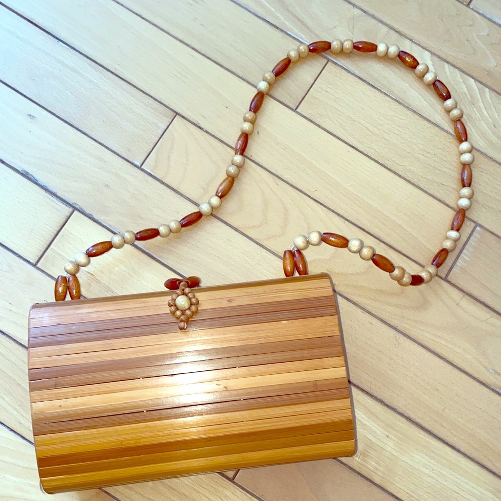 Cute vintage wood purse with a  strap.